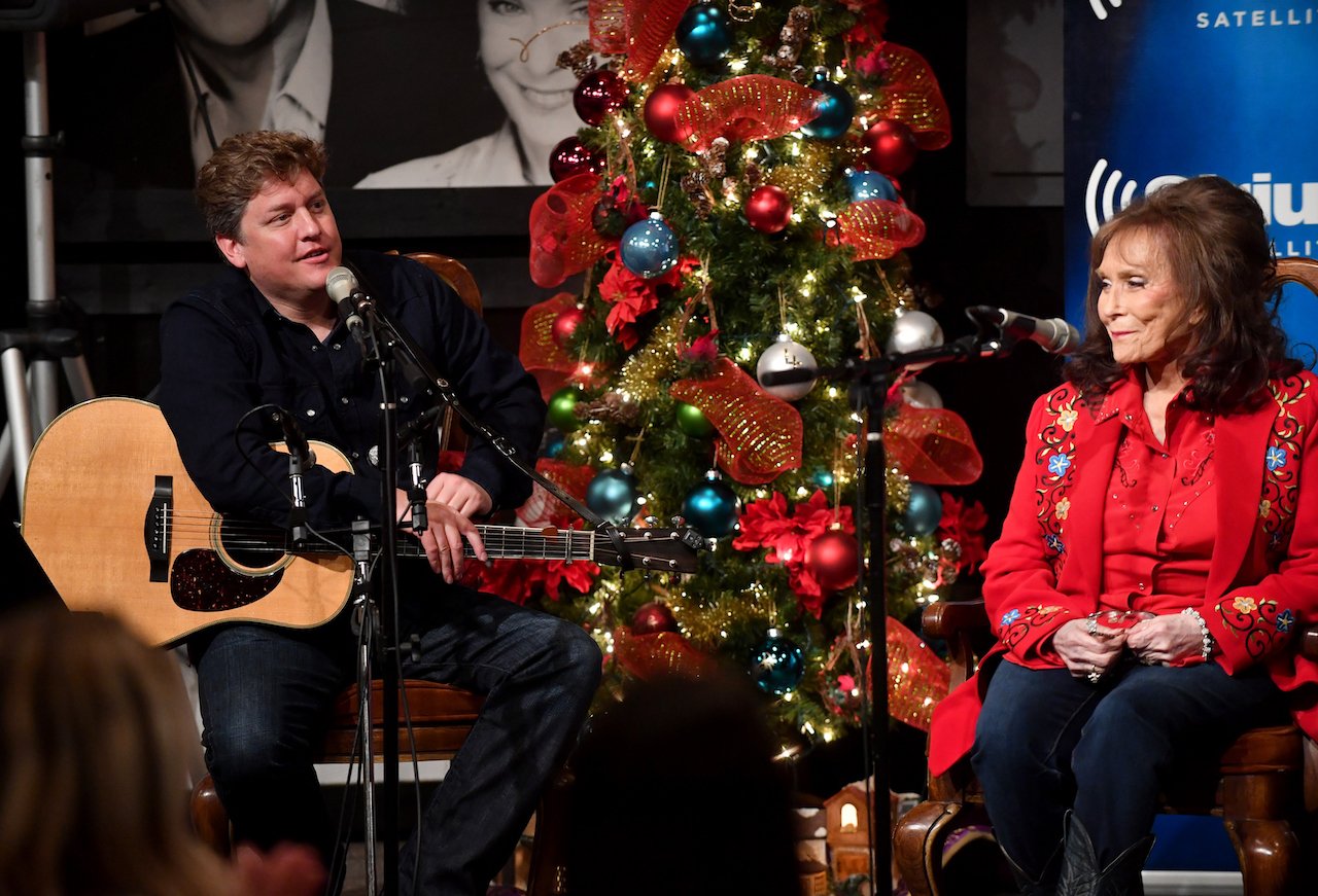 Shawn Camp and Loretta Lynn speak onstage during an interview and performance for SiriusXM's Willie's Roadhouse & Country Christmas on December 6, 2016, in Hurricane Mills, Tennessee.