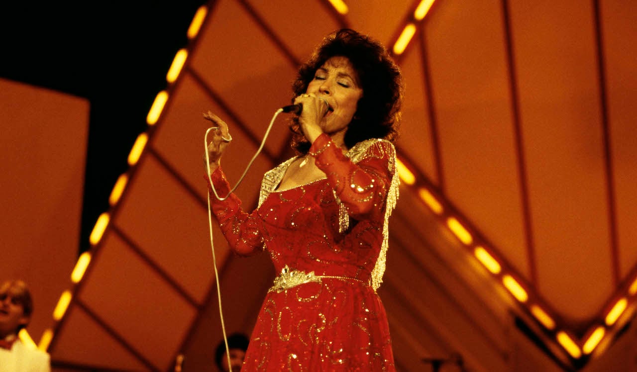 Loretta Lynn performing on stage at the Country Music Festival in Wembley.