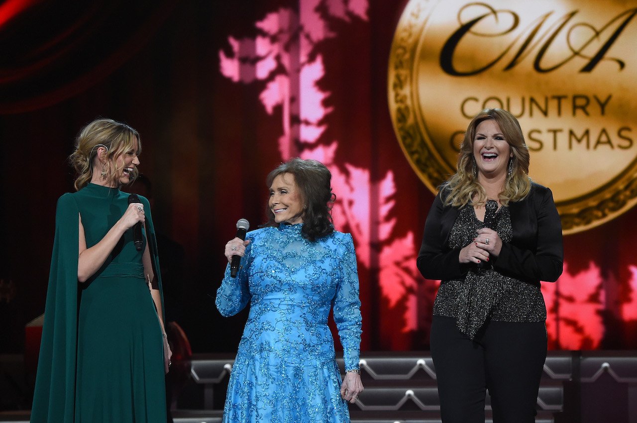 (l-r) Jennifer Nettles, Loretta Lynn, and Trisha Yearwood pictured performing during the CMA 2016 Country Christmas on November 8, 2016. Lynn famously sang about 'The Pill' and said she would have used it if she'd known about it.