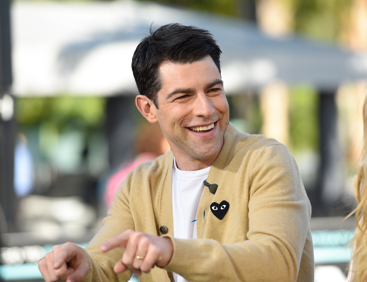 Max Greenfield visits "Extra" at Universal Studios Hollywood on October 29, 2018