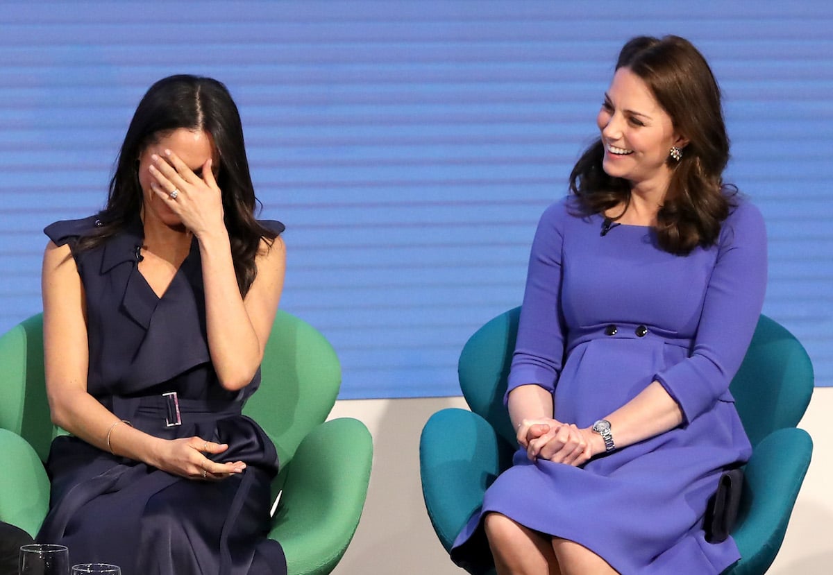 Meghan Markle and Kate Middleton, who had a 'playful' reaction to a light-hearted moment as opposed to Meghan Markle's 'discomfort,' according to a body language expert, attend the 2018 Royal Foundation Forum