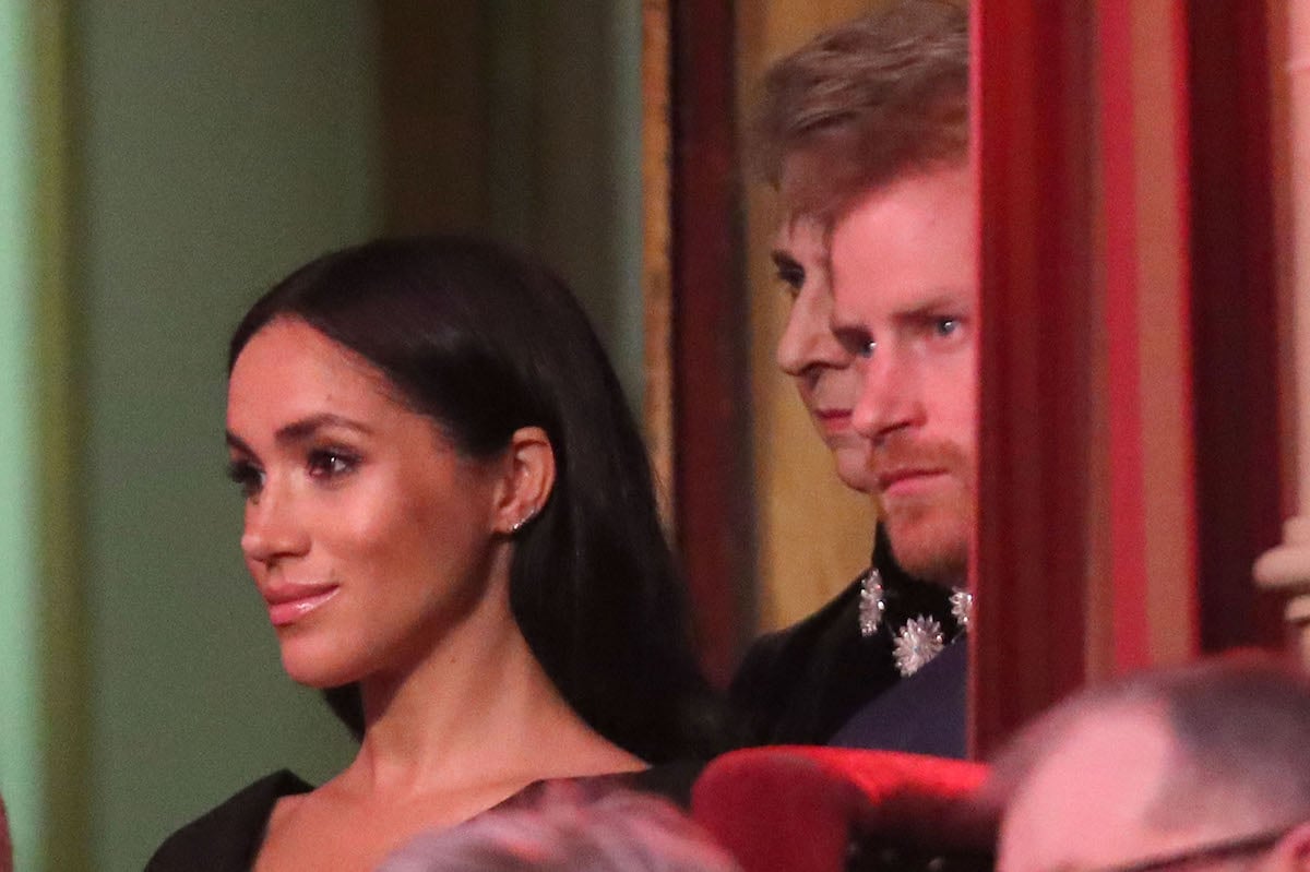 Meghan Markle, who recalled her reaction to appearing on the front cover a U.K. publication after the 2018 British Legion Festival of Remembrance in 'Harry & Meghan' Volume II, sits next to Prince Harry at the event