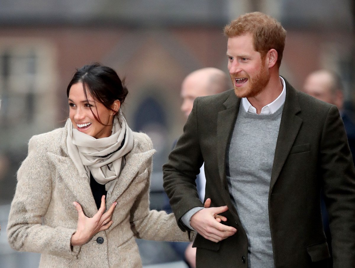 Prince Harry and Meghan Markle, who rang in 2017 with a New Year's trip to Norway, hold hands in 2018