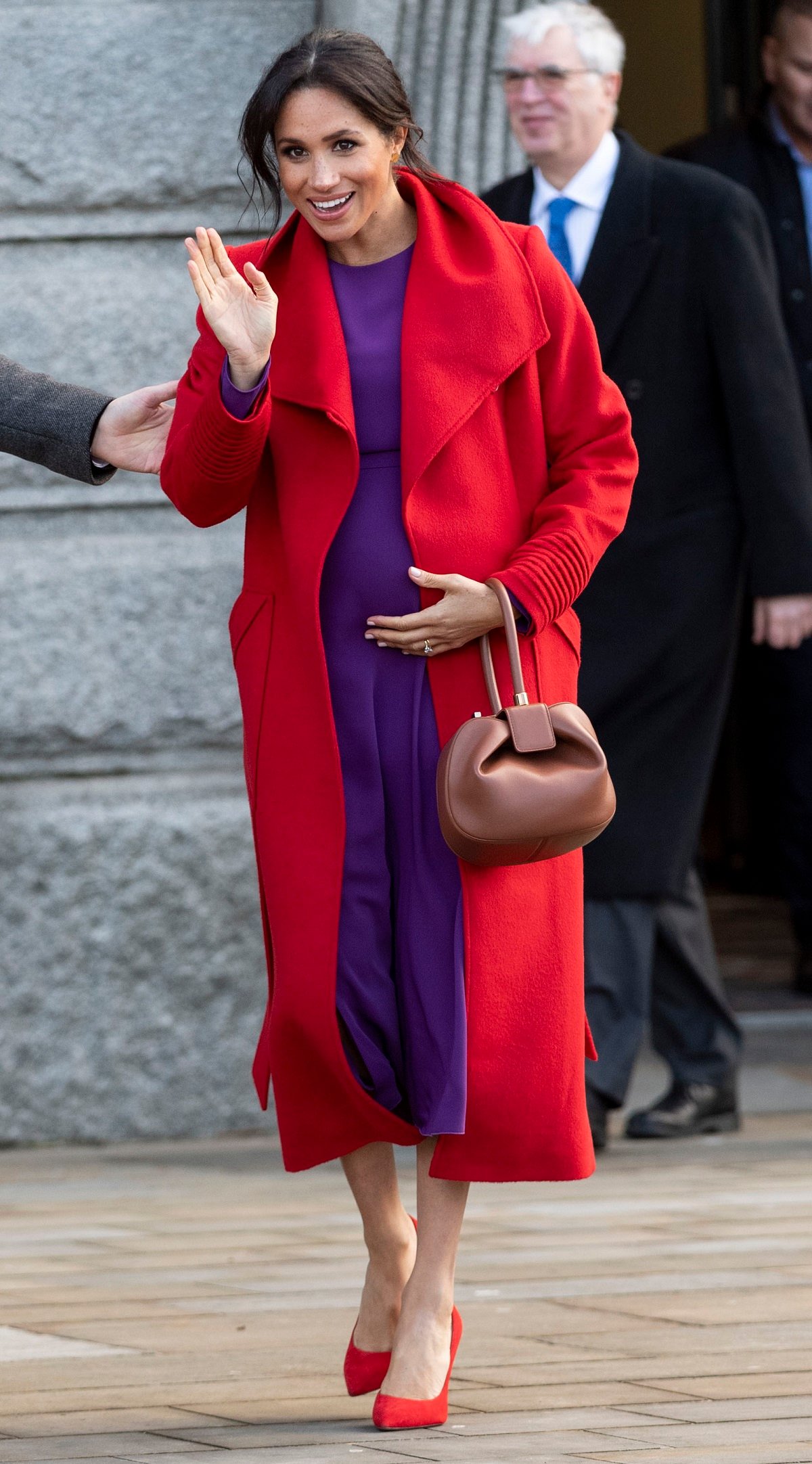 Meghan Markle waves to crowd during visit to Hamilton Square to view a new sculpture erected