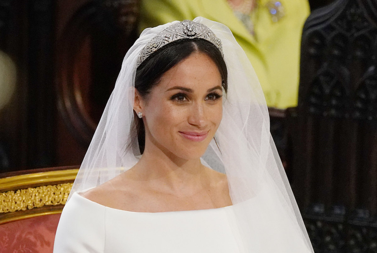 Meghan Markle, who said in 'Harry & Meghan' she wanted a croissant, a mimosa, and to play 'Going to the Chapel' on the day of her royal wedding to Prince Harry, smiles and looks on her royal wedding