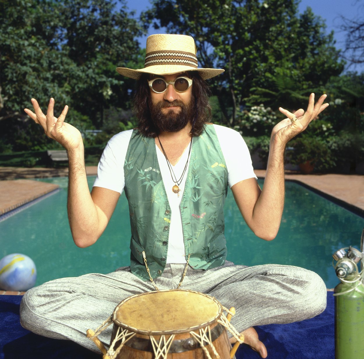 Mick Fleetwood sitting poolside in 1980, years after a 'magician' saved him from a near-death experience.