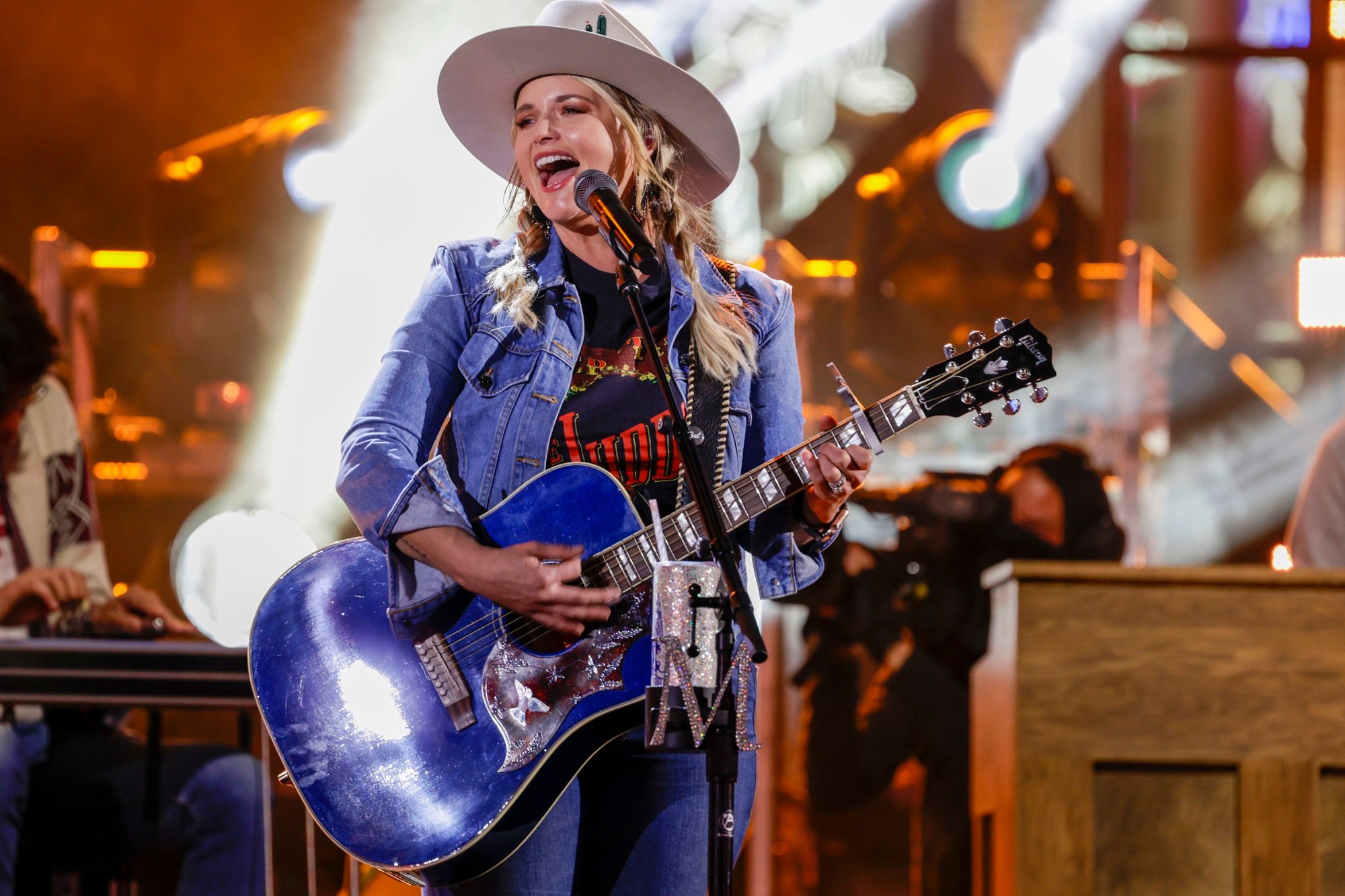 Miranda Lambert performs onstage with a blue guitar