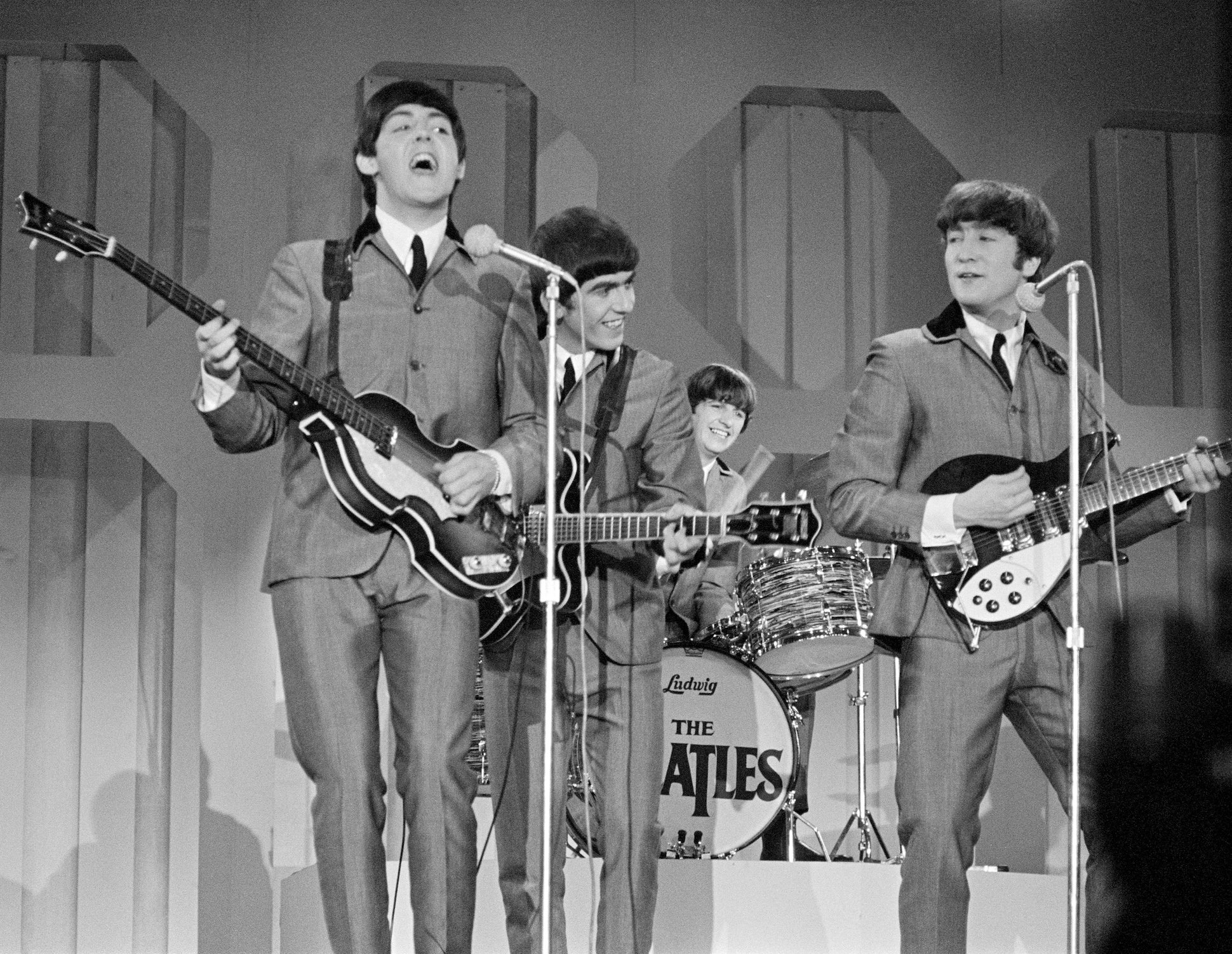 The Beatles perform on The Ed Sullivan Show (Paul McCartney, George Harrison, Ringo Starr, and John Lennon)
