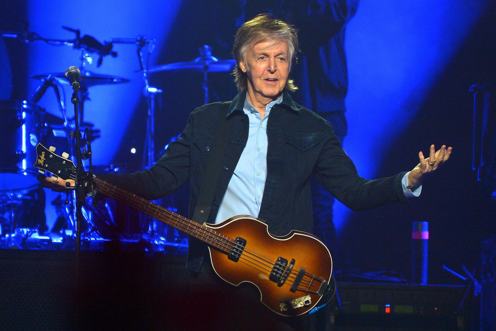 Paul McCartney performs with his guiat at the O2 Arena during his Freshen Up tour in London, England