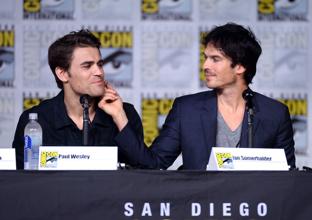 Ian Somerhalder touches Paul Wesley's cheek at the "The Vampire Diaries" panel at Comic-Con International 2016