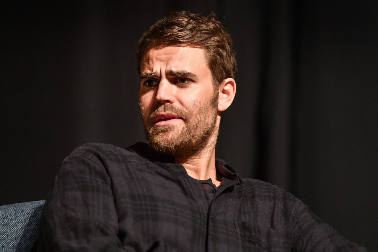 Paul Wesley against a black background at a Comic-Con panel for 'The Vampire Diaries'