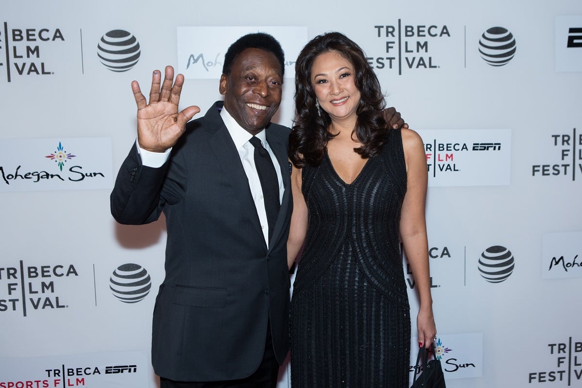 Pele and wife Marcia Aoki attend the world premiere of 'Pele Birth of a Legend'