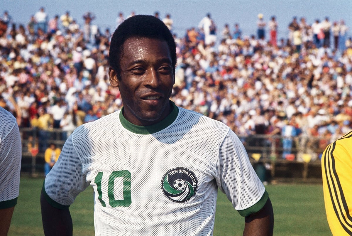 Pele standing on the field in New York Cosmos uniform