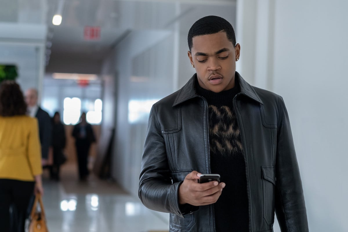 Michael Rainey Jr. as Tariq St. Patrick looking at his cell phone in 'Power Book II: Ghost '