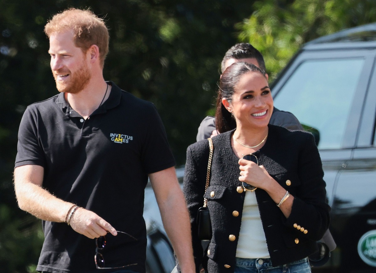 Prince Harry and Meghan Markle are seen at the Jaguar Land Rover Driving Challenge on day one of the Invictus Games The Hague