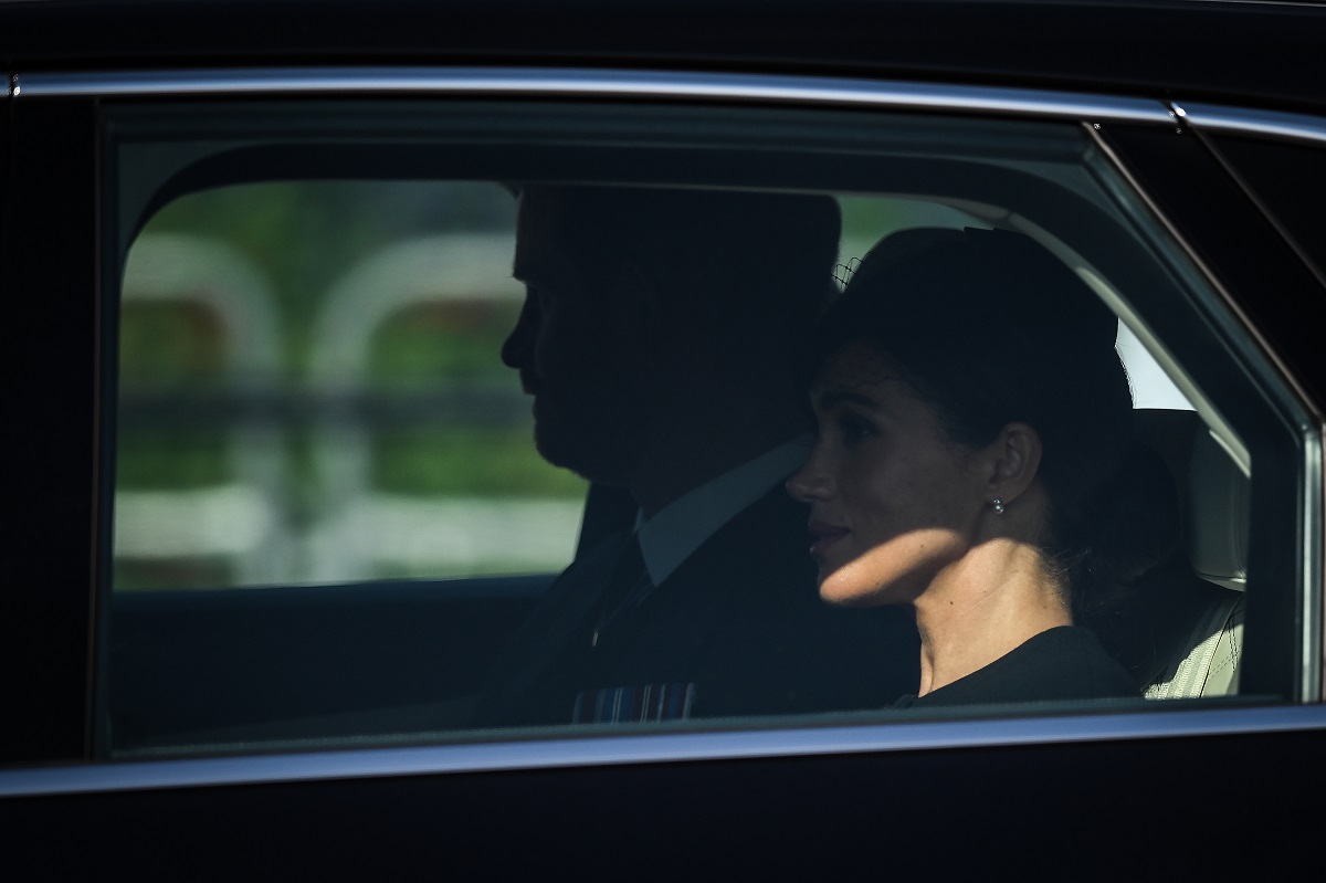 Prince Harry and Meghan Markle in a car after attending a service for the reception of Queen Elizabeth II's coffin at Westminster Hall