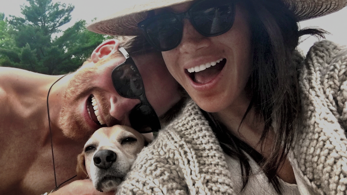 Prince Harry and Meghan Markle, who said she wasn't 'interested' in a 'guy with that much ego' on 'Harry & Meghan' after Prince Harry was late for their first date in 2016, smiles with Meghan's dog Markle in a personal photo seen on 'Harry & Meghan'