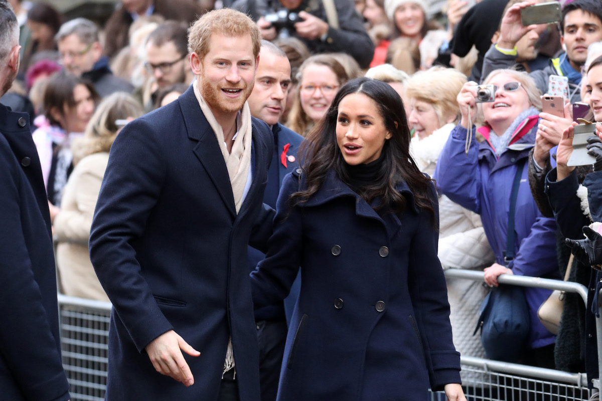 Prince Harry and Meghan Markle, who spent New Year's in 2017 on a trip to Norway, greet crowds.