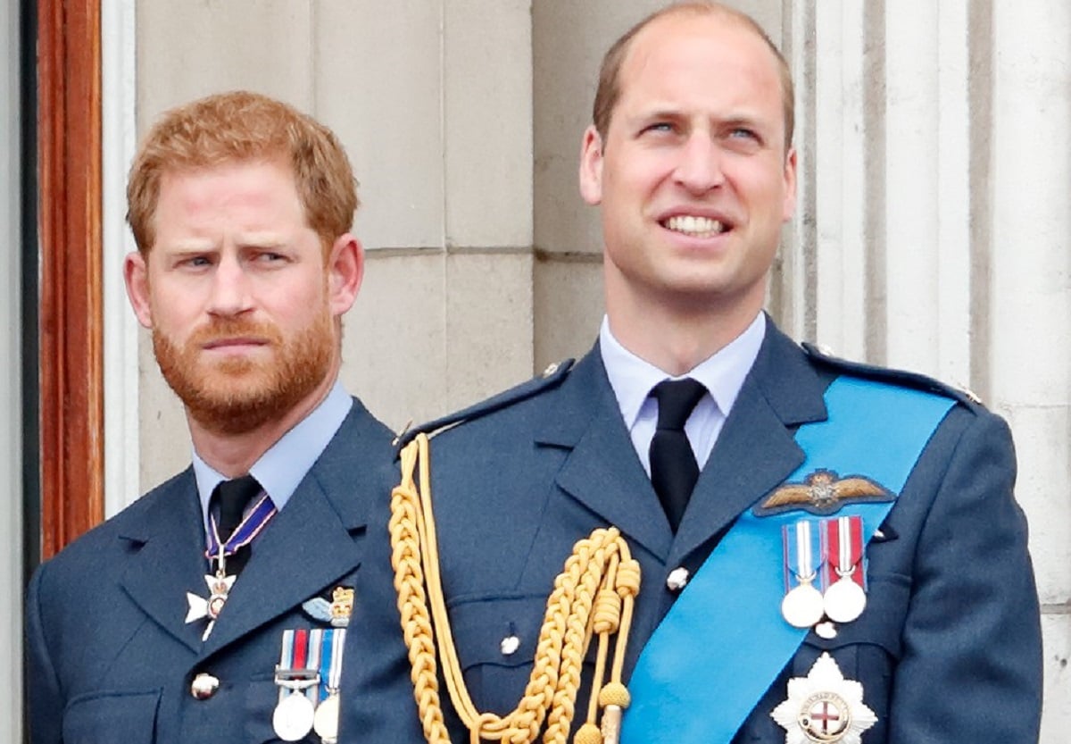 Prince Harry and Prince William standing on the Buckingham Palace balcony for flypast to mark the centenary of the Royal Air Force