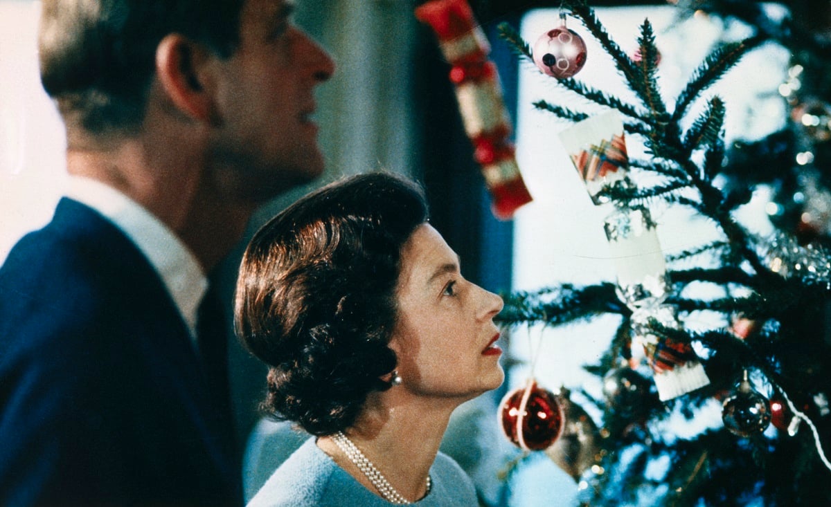 Queen Elizabeth II and Prince Philip putting the finishing touches on a Christmas tree in a royal family documentary