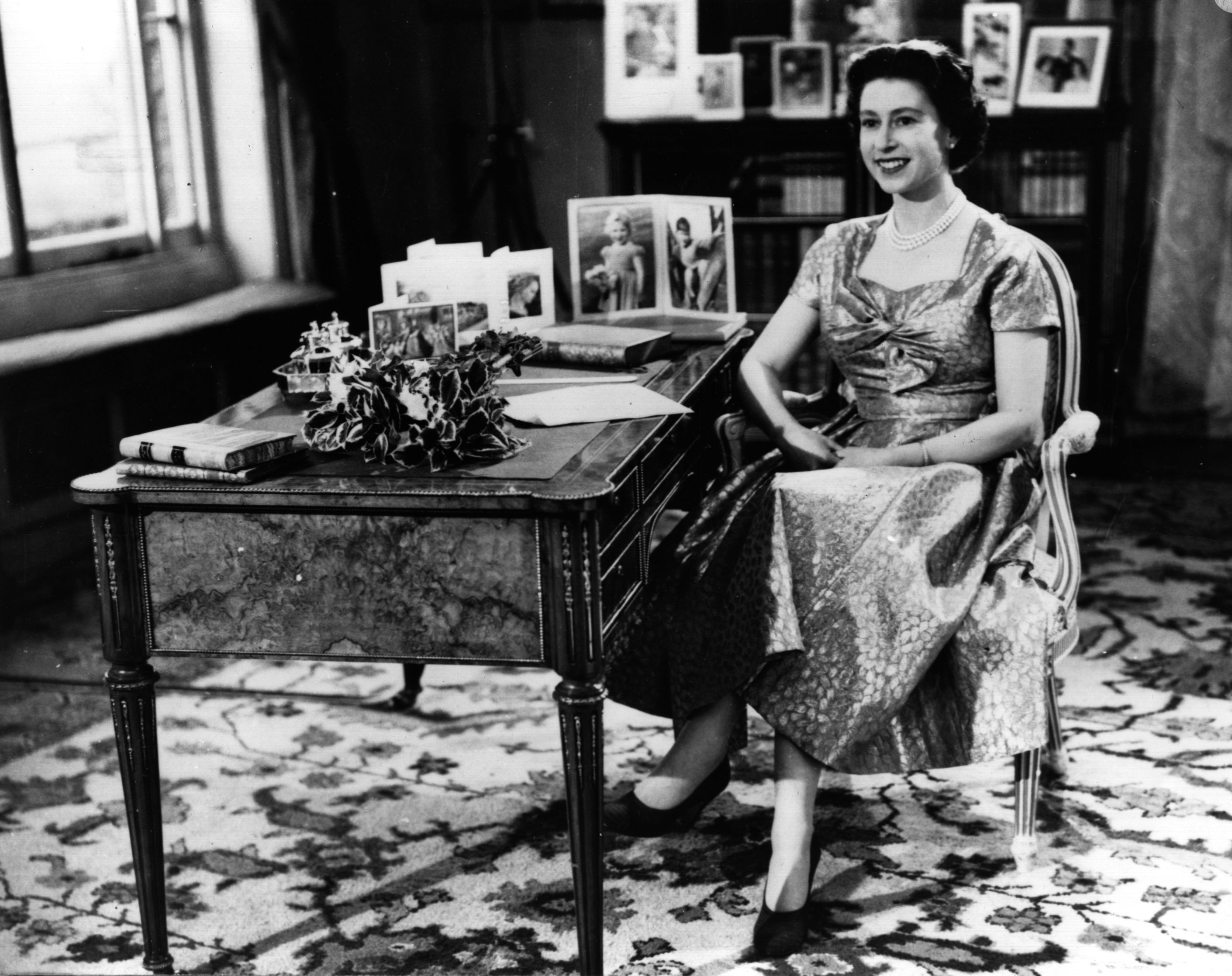 Queen Elizabeth II smiling during her first Christmas Day television speech to the nation in 1957