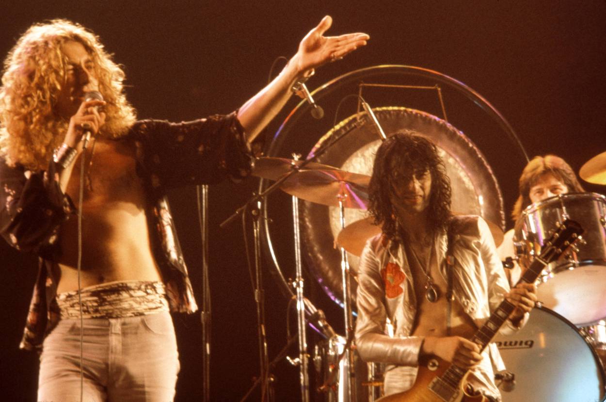Led Zeppelin's Robert Plant (left), Jimmy Page, and John Bonham (rear), who might have had a famous movie scene based on them, perform in 1977.