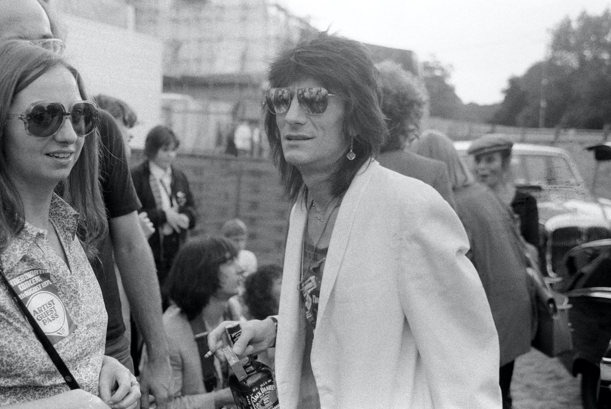 Rolling Stones guitarist Ronnie Wood stands backstage at the Knebworth Festival in 1979.
