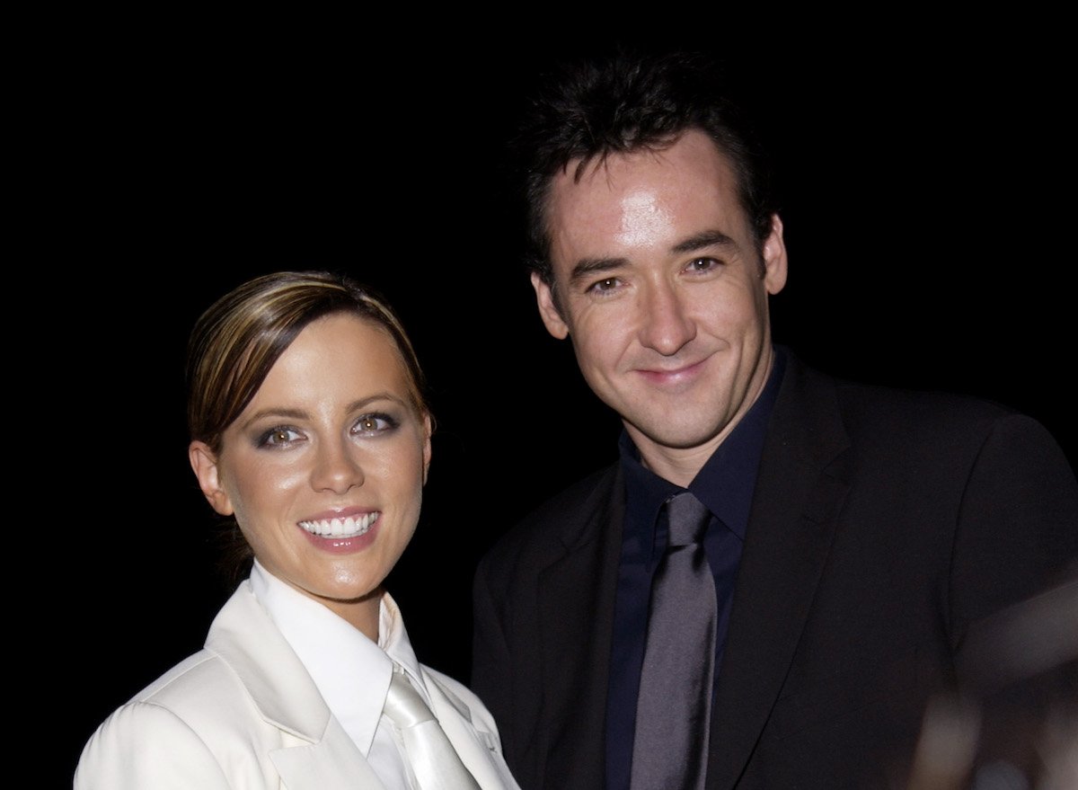 Kate Beckinsale and John Cusack smile at a media event for Serendipity