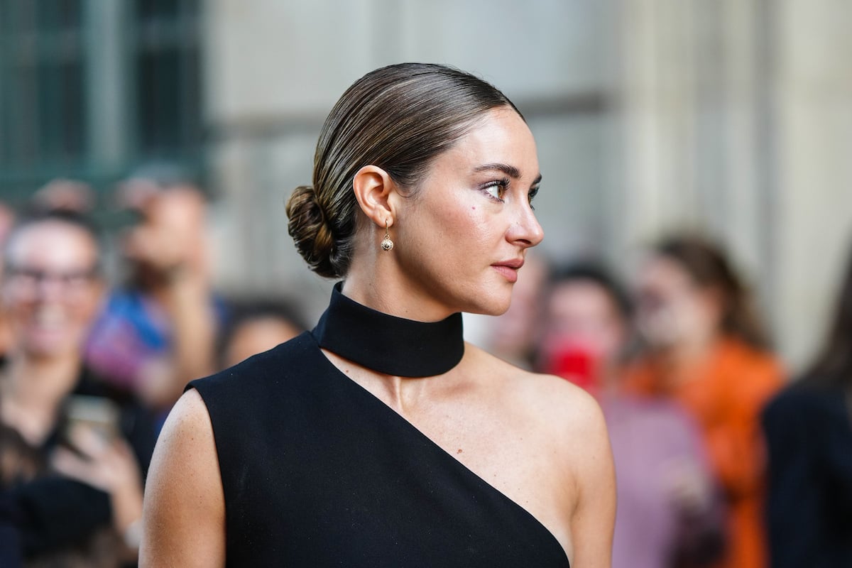 Shailene Woodley in a black asymmetrical dress with a high neck