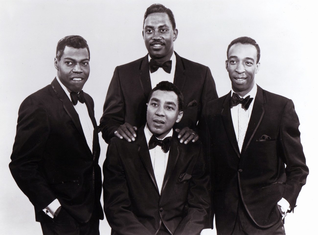 Smokey Robinson and the Miracles in suits. 