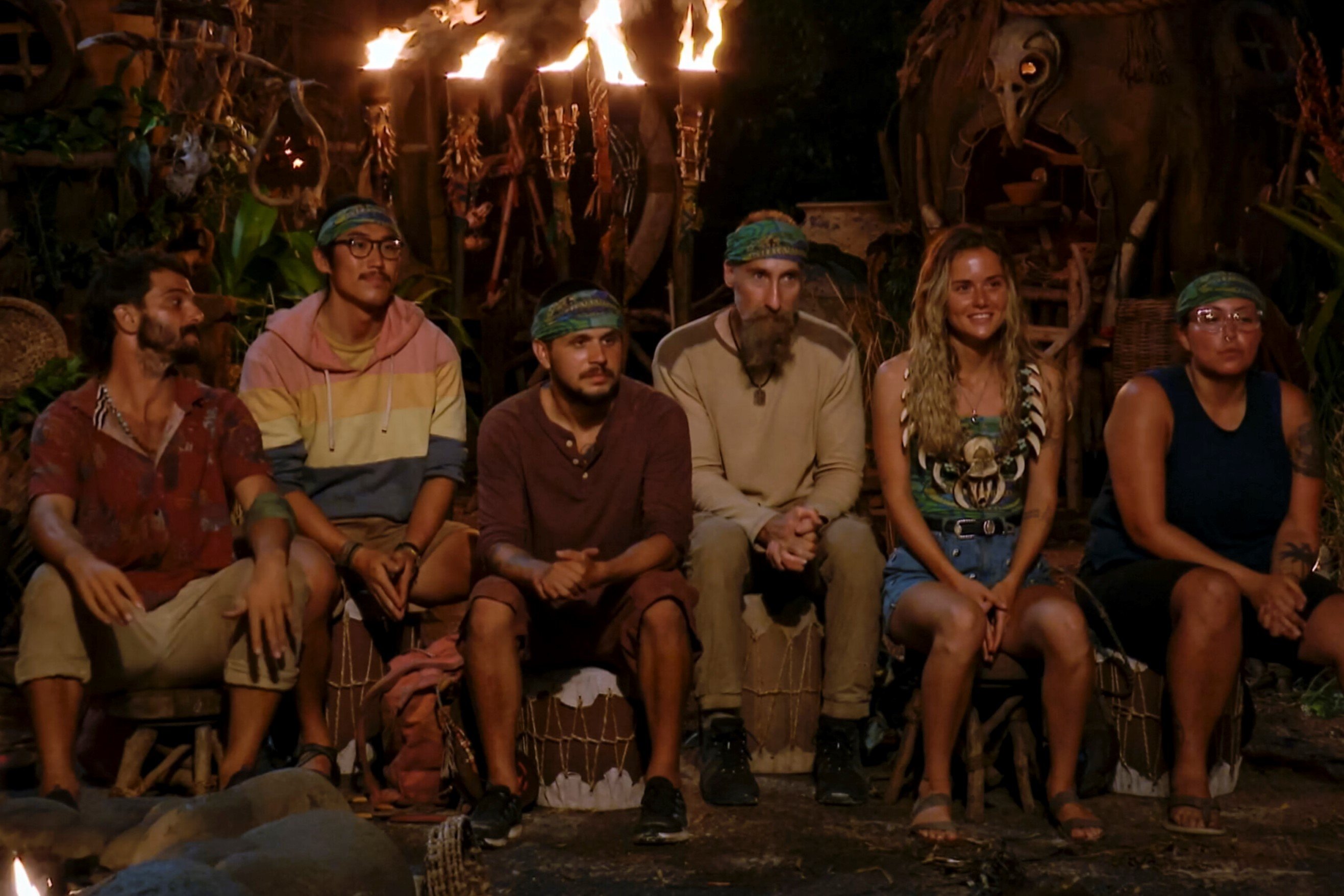 Cody Assenmacher, Owen Knight, Jesse Lopez, Mike Gabler, Cassidy Clark, and Karla Cruz Godoy, who starred in 'Survivor' Season 43 in 2022, attend Tribal Council in episode 12.