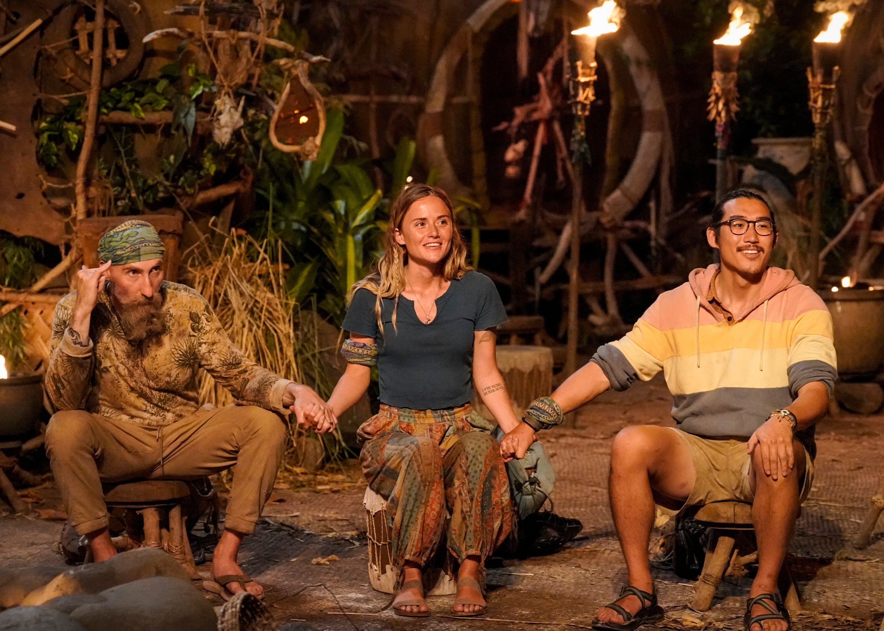 Mike Gabler, Cassidy Clark, and Owen Knight hold hands during the Final Tribal Council in 'Survivor' Season 43 on CBS.
