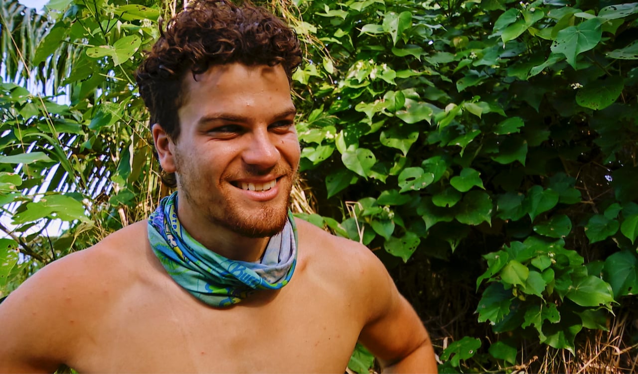 Sami Layadi smiles with his buff around his neck on 'Survivor 43'.