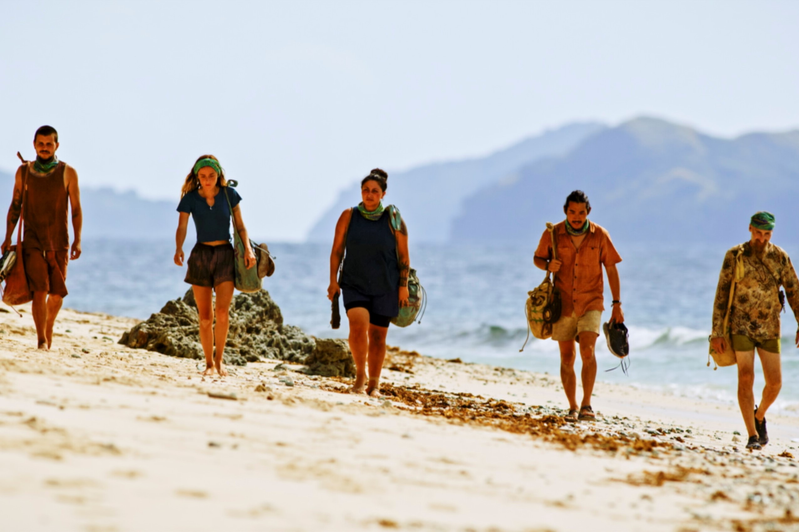 Jesse Lopez, Cassidy Clark, Karla Cruz Godoy, Owen Knight, and Mike Gabler walk on the beach during the 'Survivor' Season 43 finale, where one of them will win.