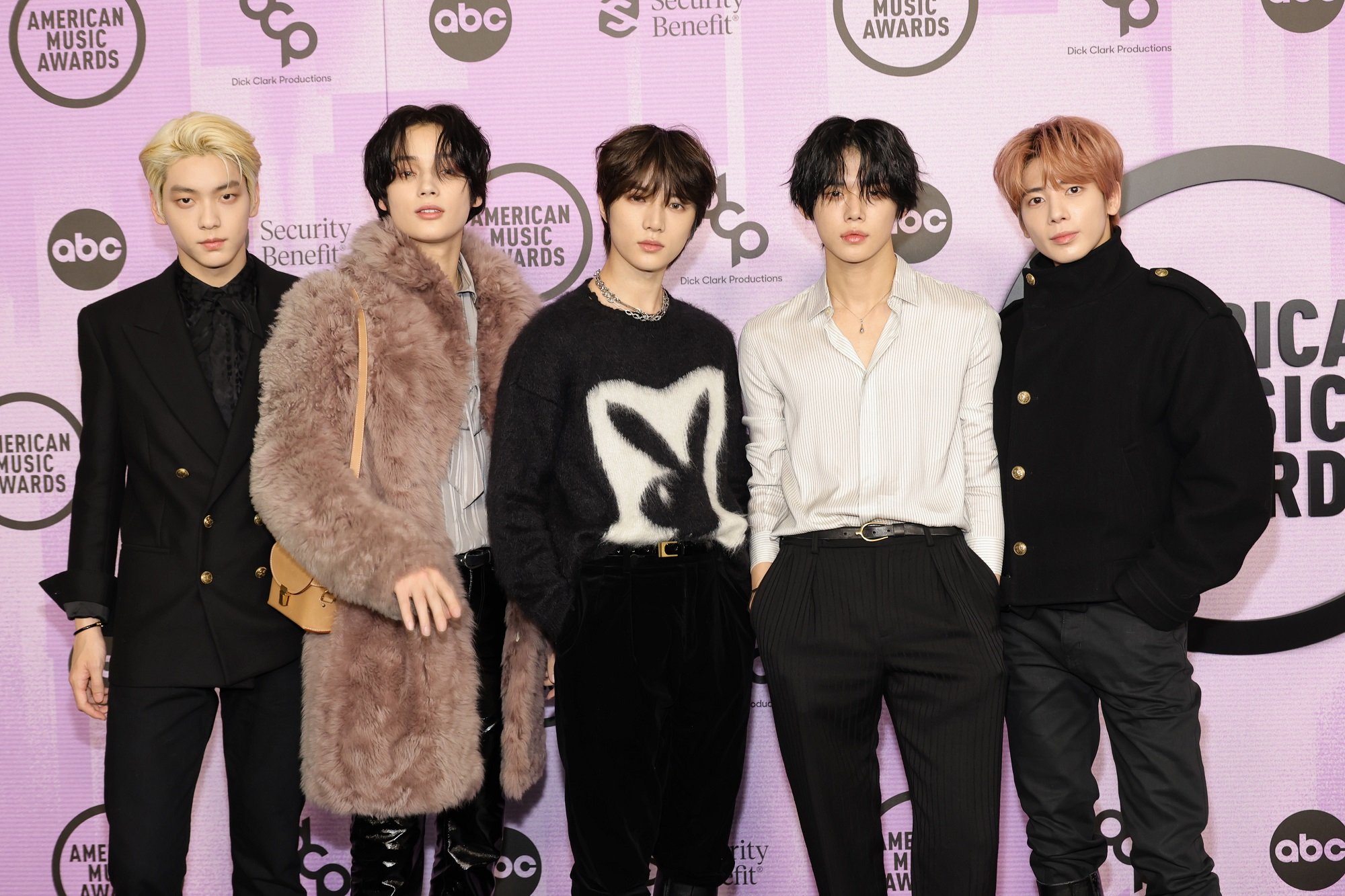 Soobin, Huening Kai, Beomgyu, Yeonjun, and Taehyun of TXT stand together at the 2022 American Music Awards