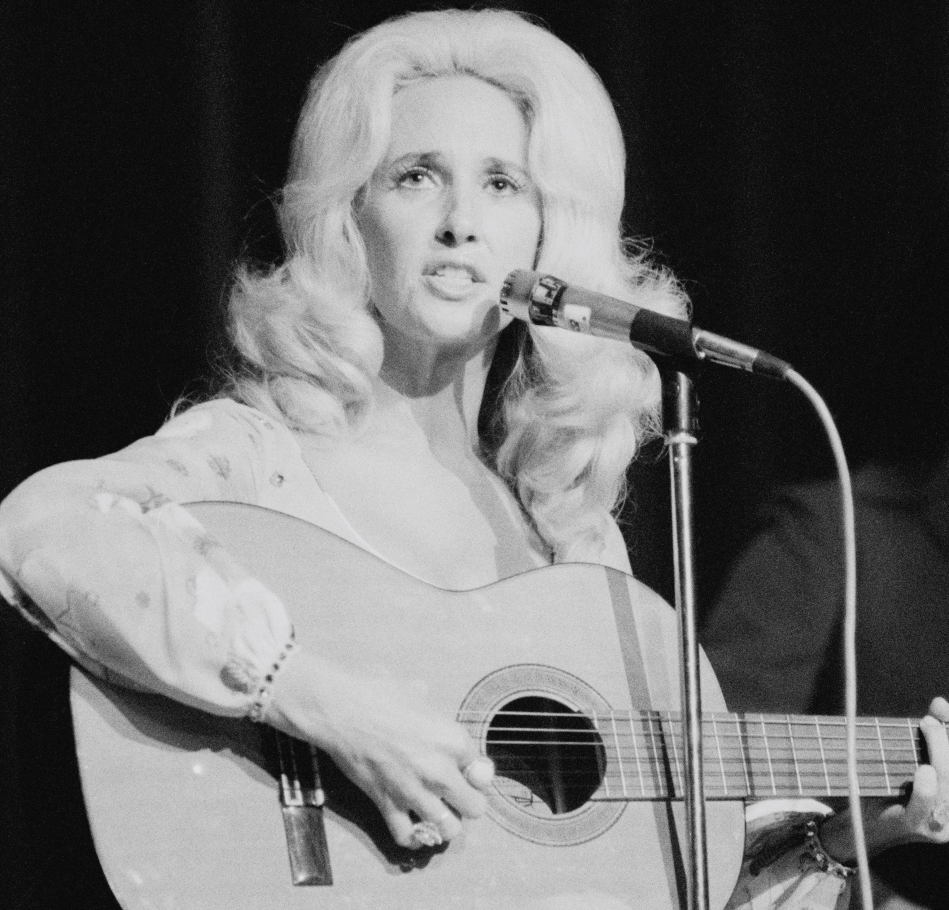 "Stand By Your Man" singer Tammy Wynette with a guitar