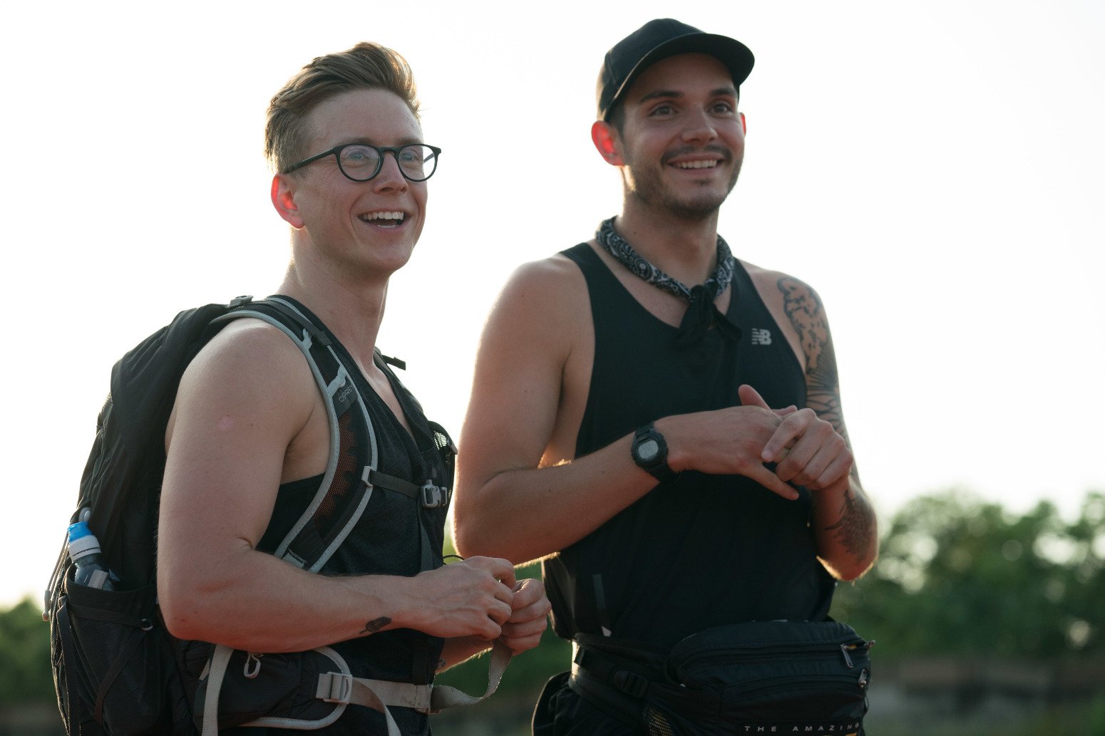 'The Amazing Race' Season 31 runner-ups Tyler Oakley and Korey Kuhl. They're standing next to one another and smiling.