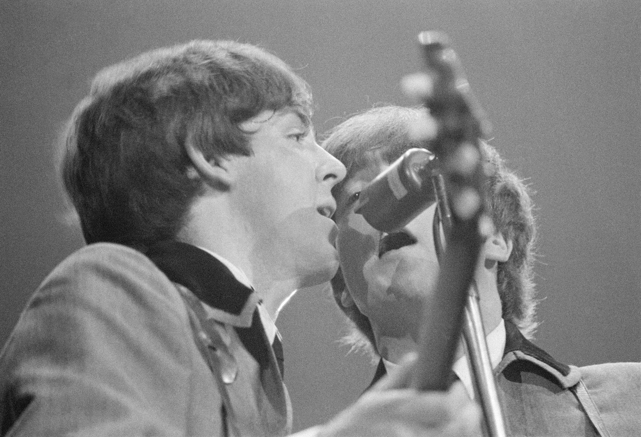 Paul McCartney and John Lennon of The Beatles perform at the Washington Coliseum in Washington DC