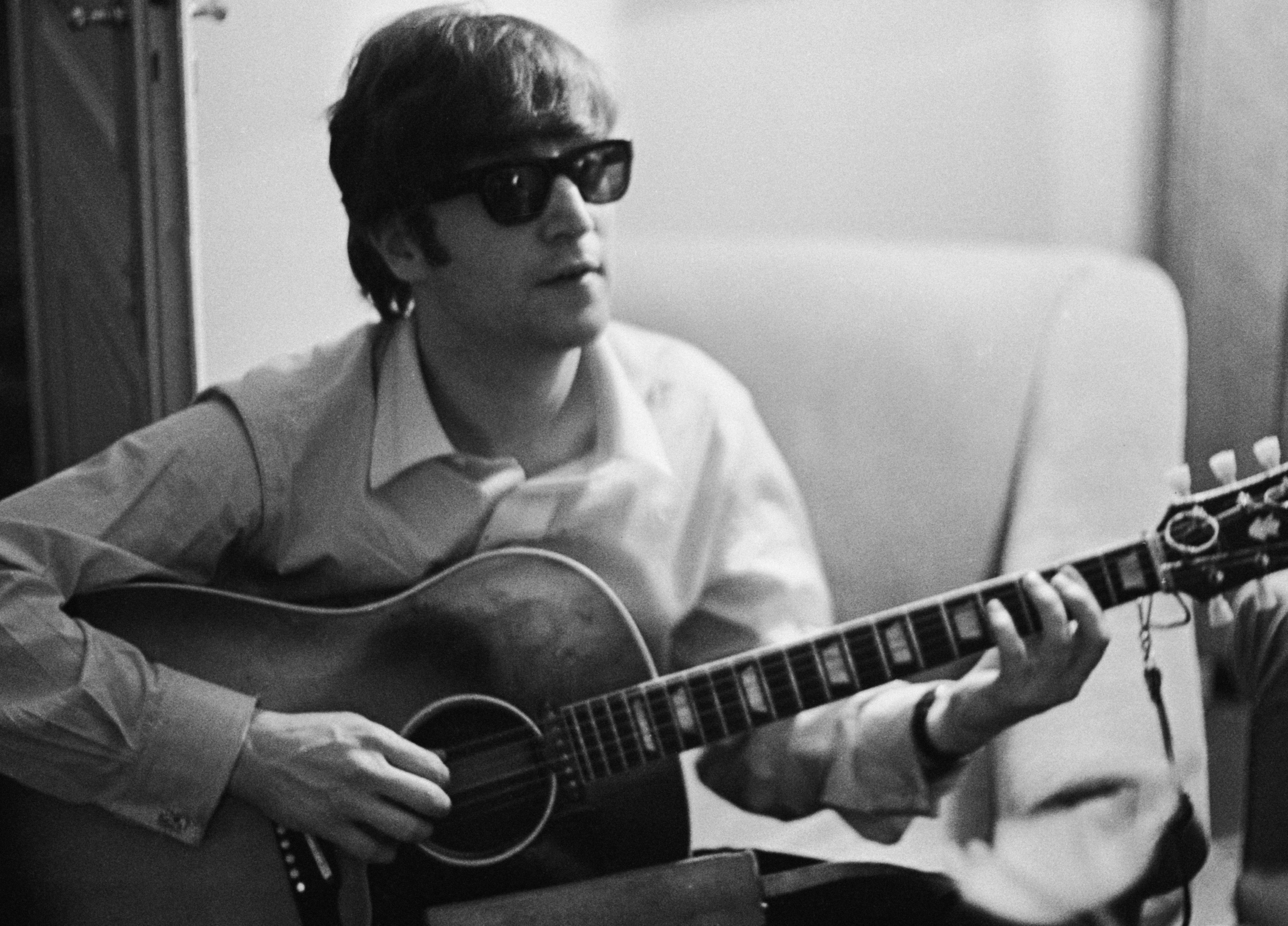 The Beatles' John Lennon with a guitar