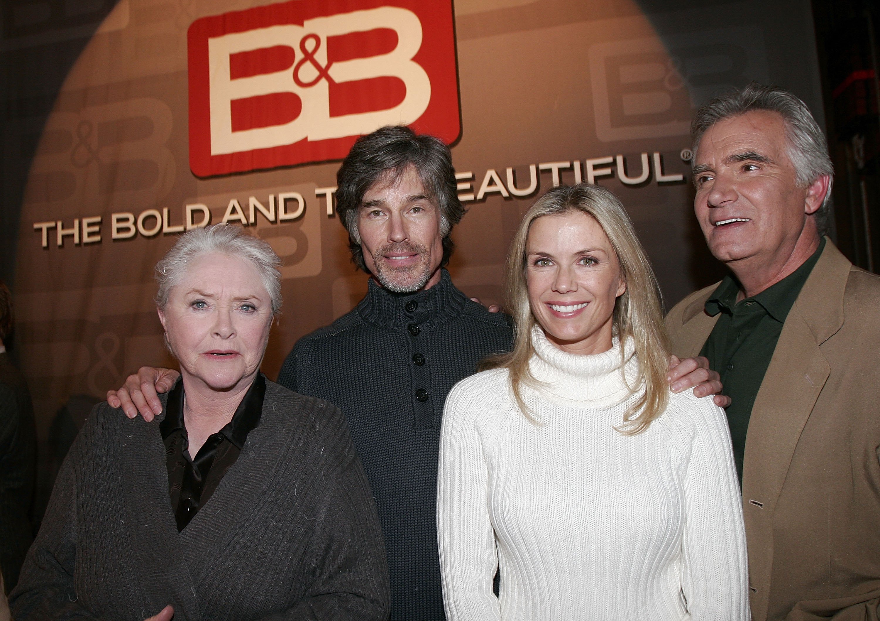 'The Bold and the Beautiful' stars Susan Flannery, Ronn Moss, Katherine Kelly Lang, and John McCook posing together onset during an anniversary celebration.