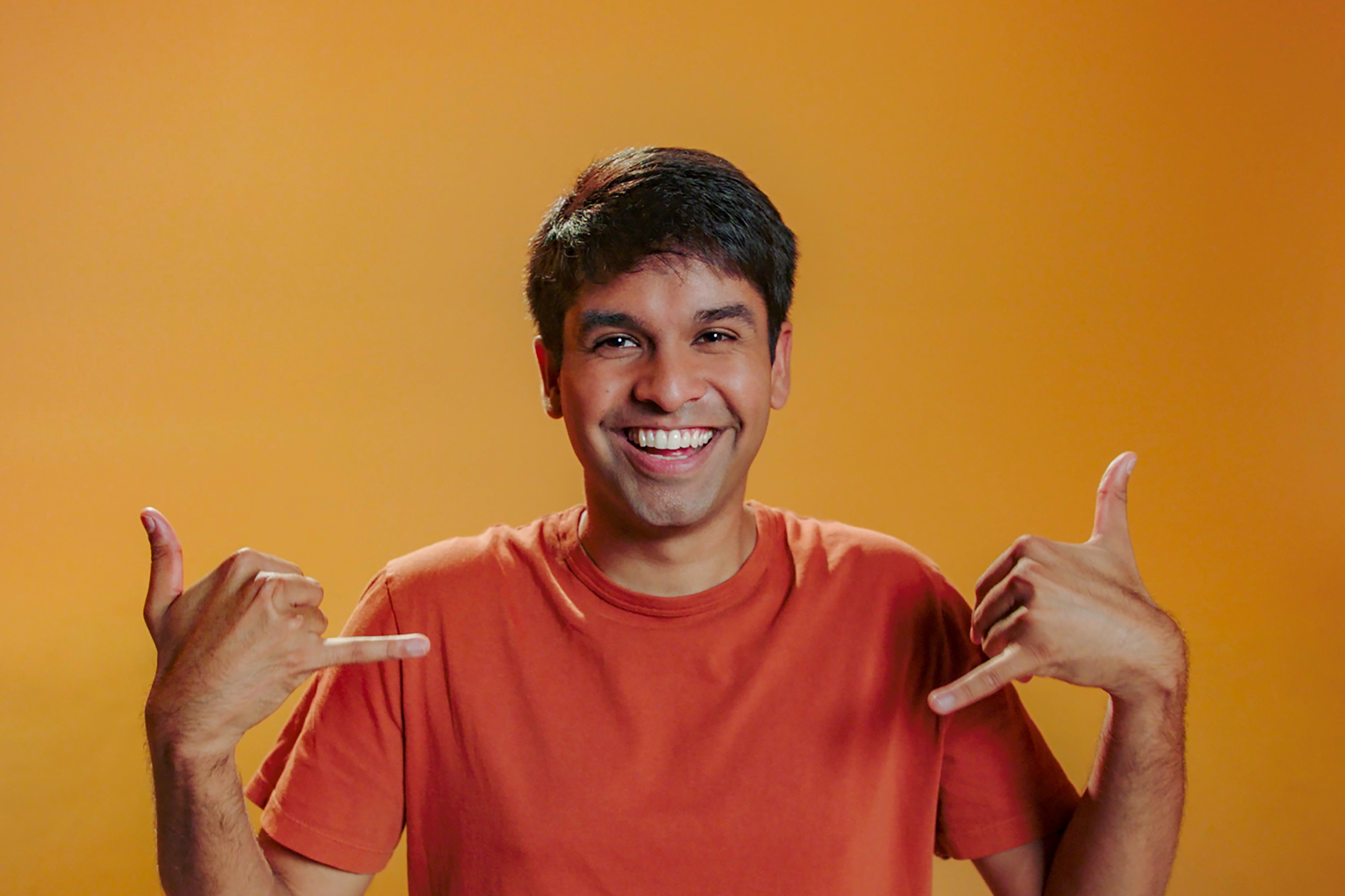 Shubham Goel, who is competing in 'The Circle' Season 5 on Netflix, wears an orange shirt.