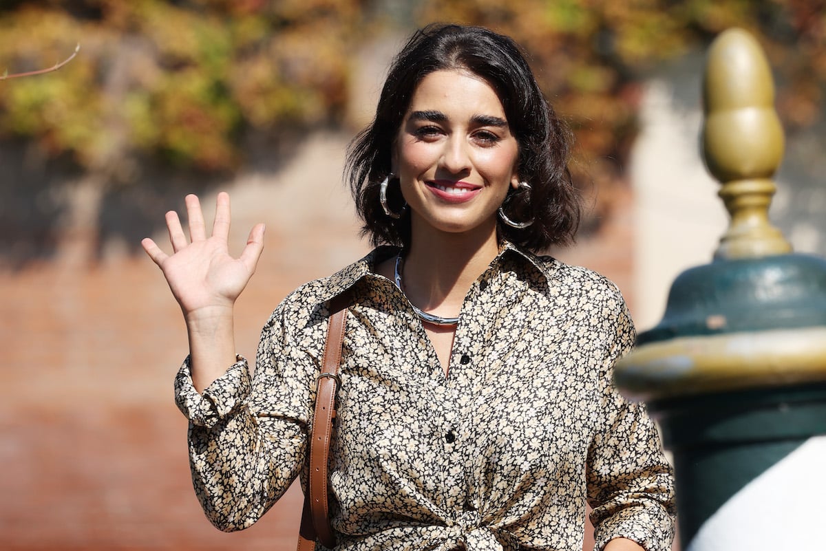 Simona Tabasco waves to fans at the 79th Venice International Film Festival