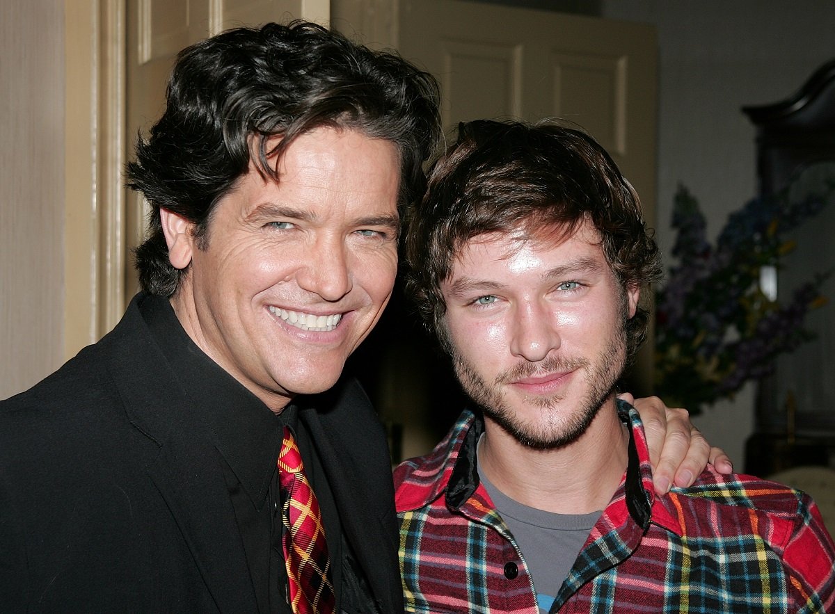 'The Young and the Restless' star Michael Damian in a black suit, and Michael Graziadei in a plaid shirt; pose together on set.