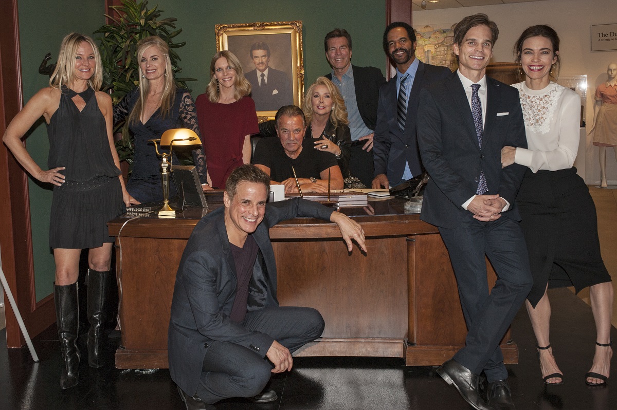 'The Young and the Restless' cast members pose near a desk in the Newman Enterprises office.
