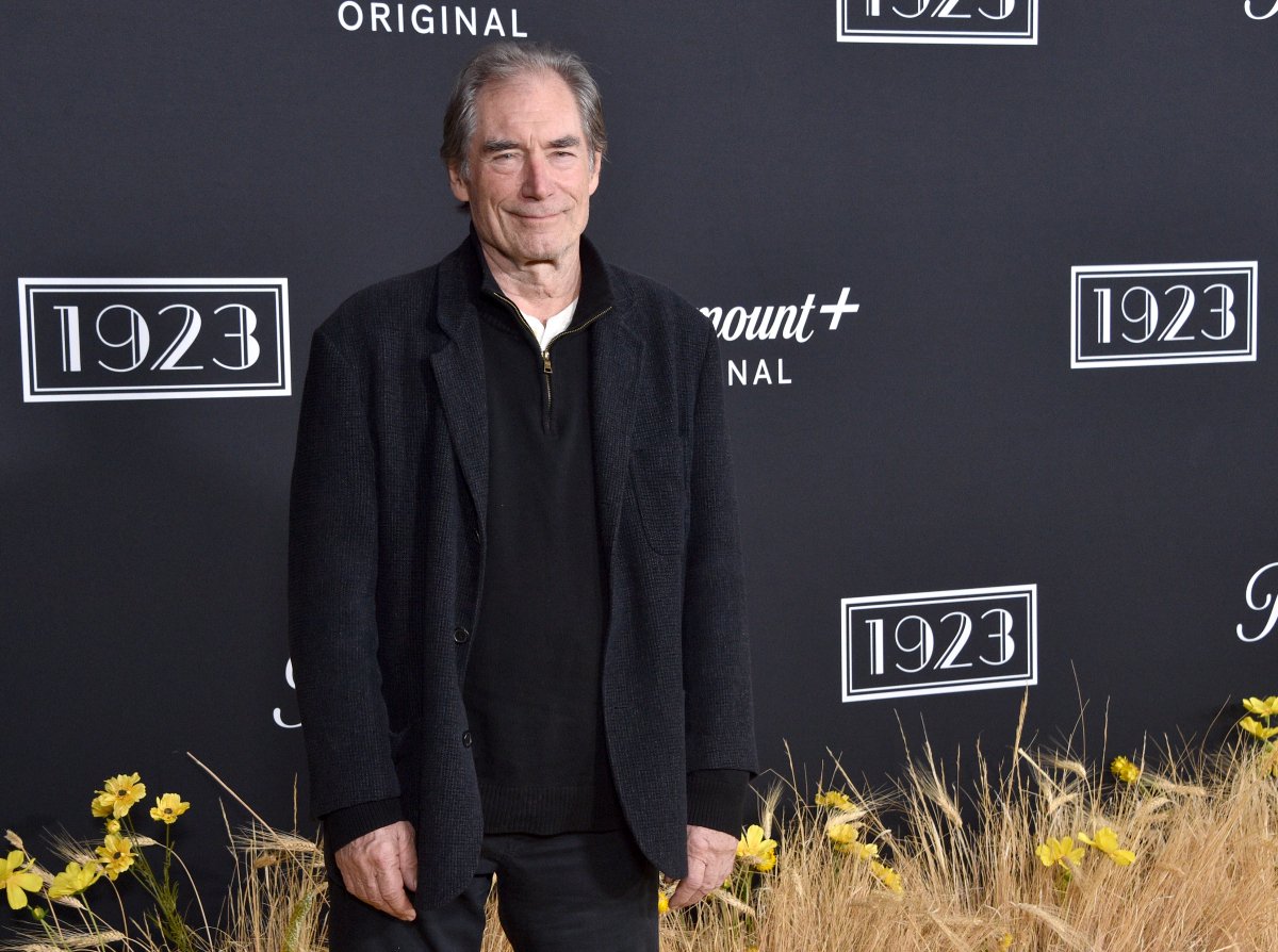 Timothy Dalton plays Donald Whitfield in 1923. Dalton attends the 1923 premiere wearing a black pullover and black pants and coat.