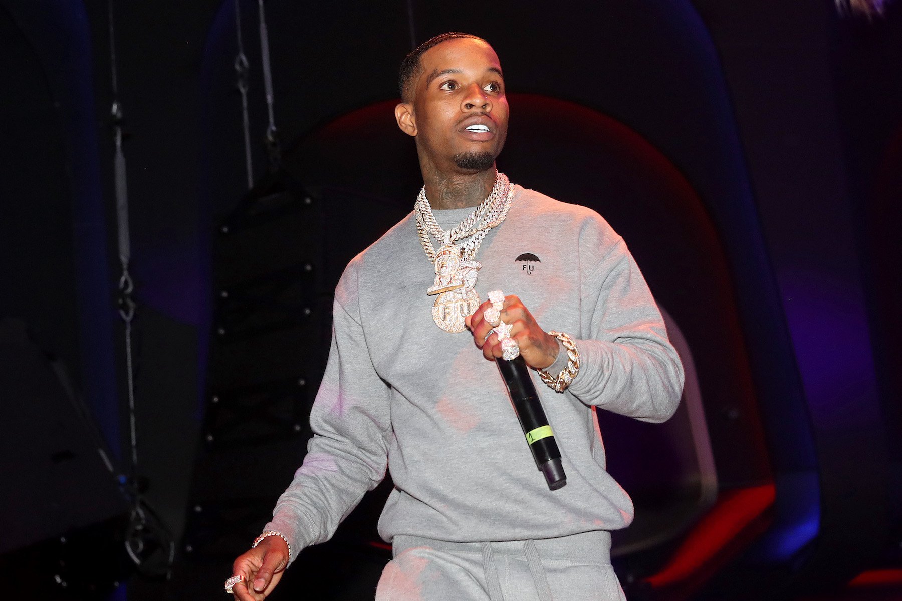Tory Lanez, alleged to have shot Megan Thee Stallion, performing in a grey sweatsuit