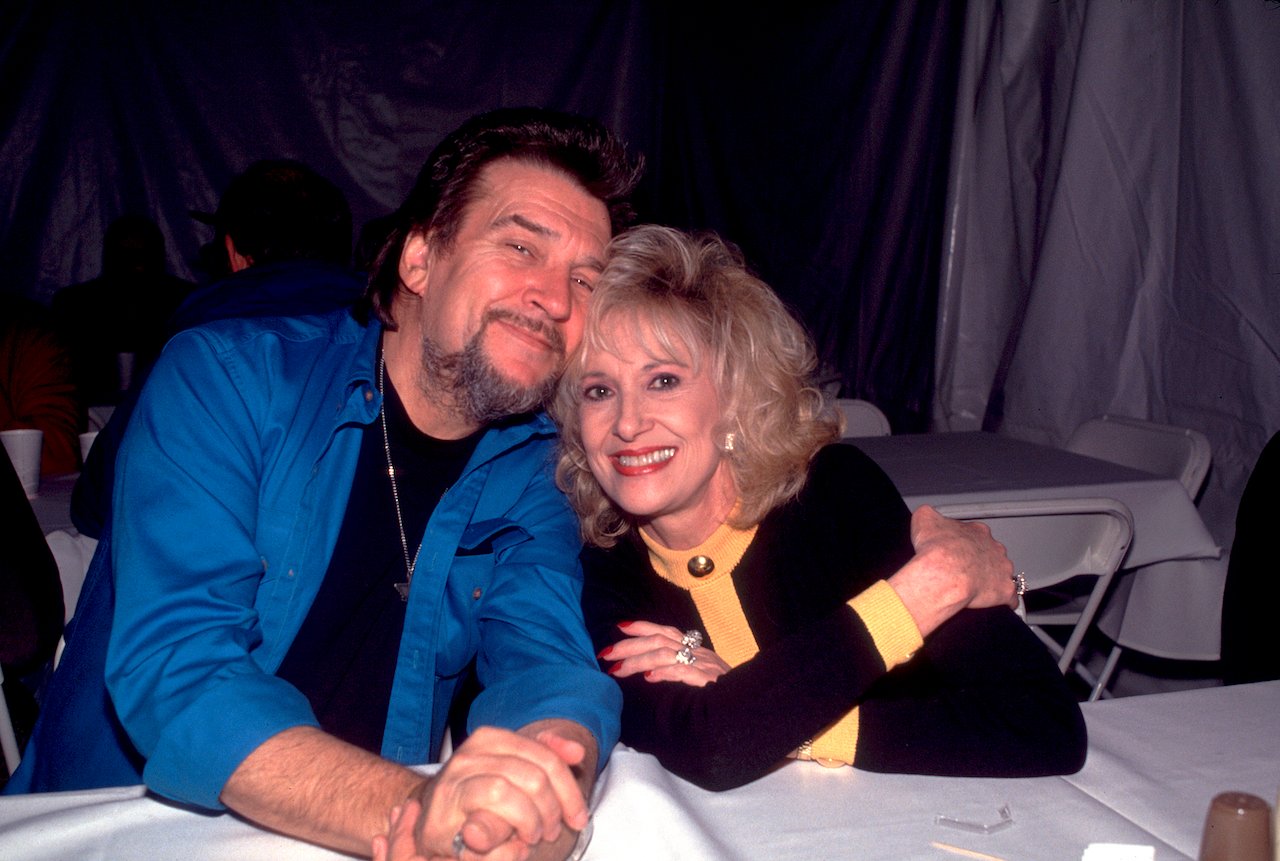Waylon Jennings and Tammy Wynette pose together before a video shoot for the song "Amazing Grace" in 1994.