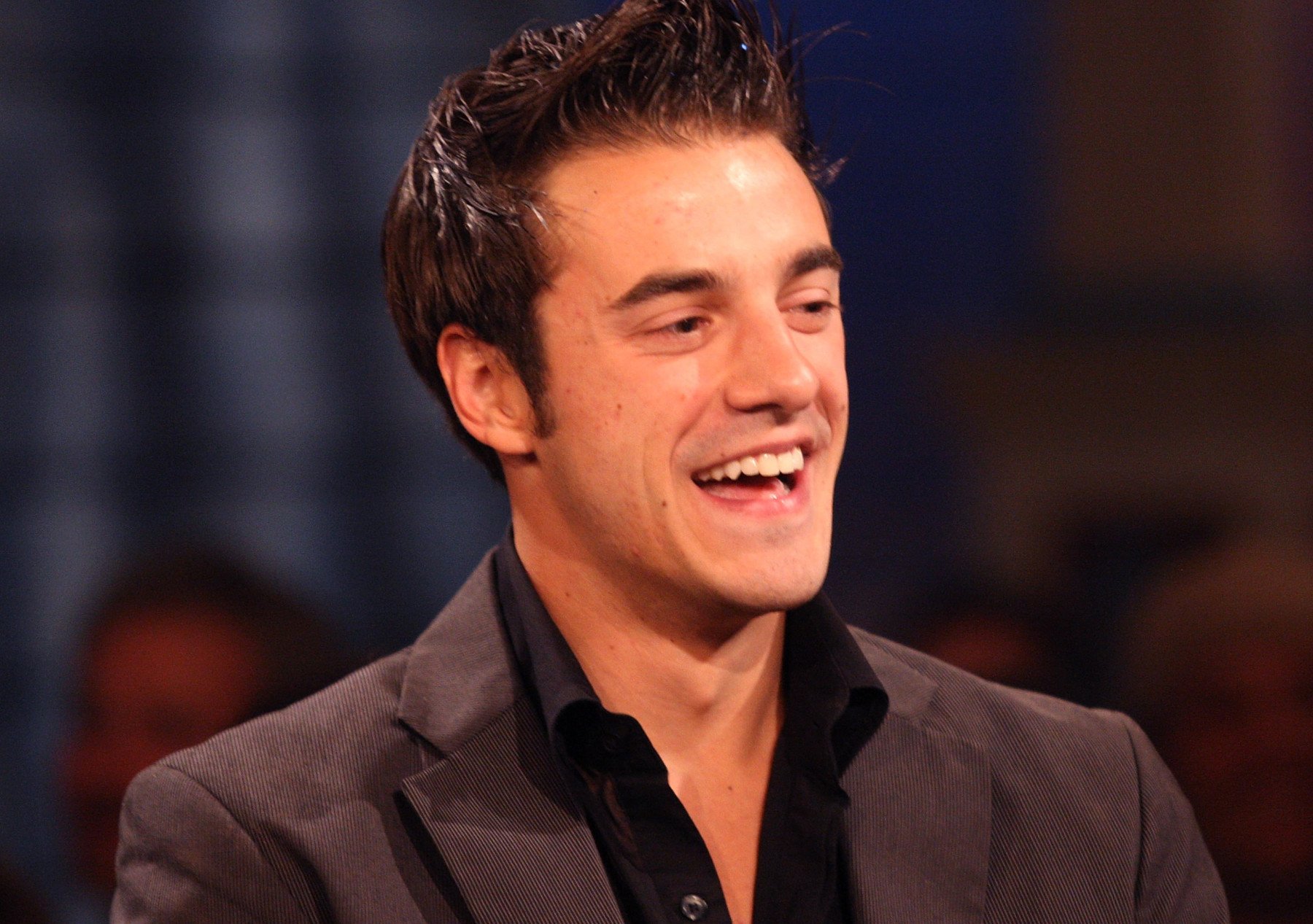 Dan Gheesling for our article about who won 'Big Brother' Season 10. He's wearing a brown shirt, has his hair gelled, and is smiling.