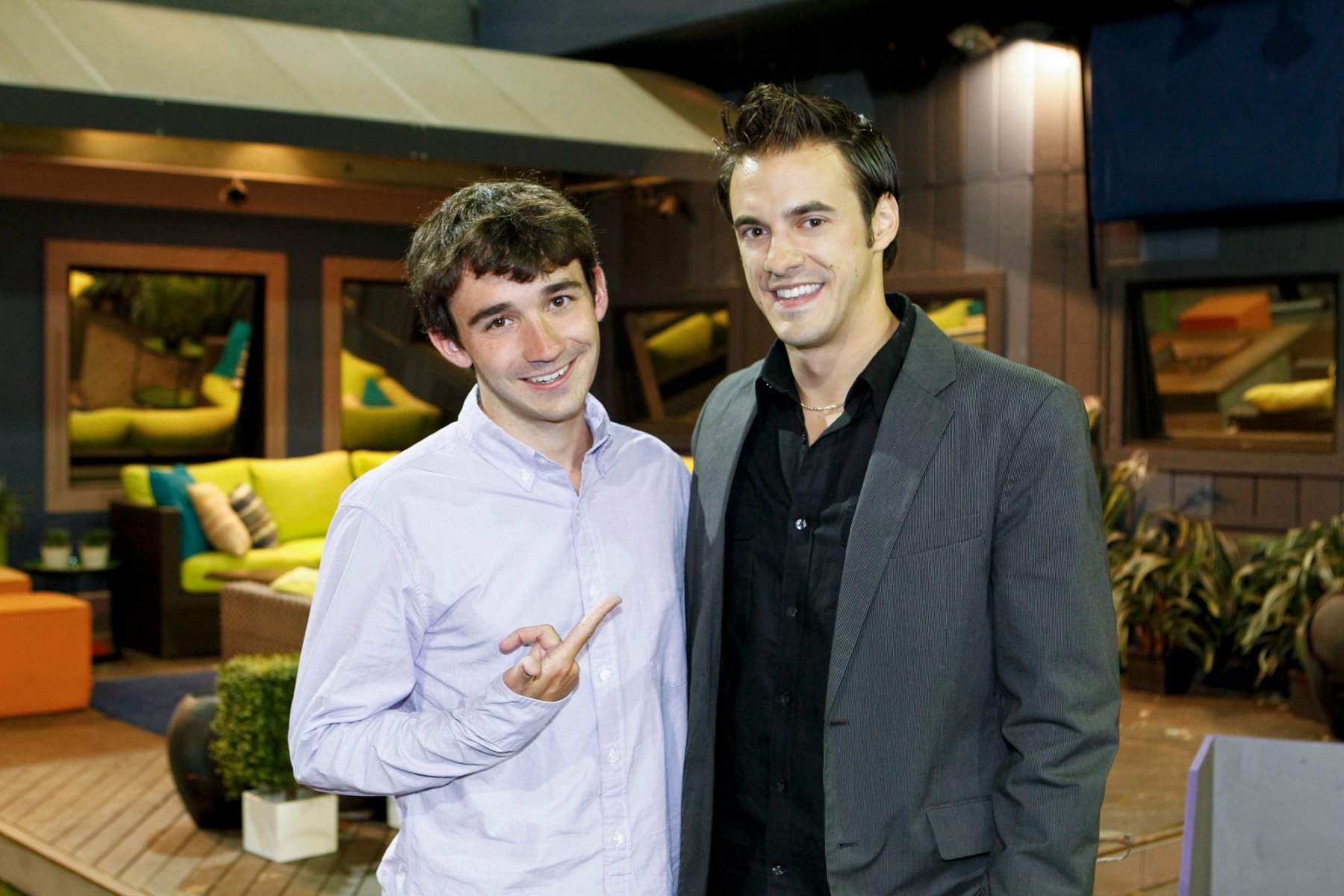 'Big Brother' Season 14 winner and runner-up Ian Terry and Dan Gheesling. The two are standing next to one another. Ian is pointing up at Dan, and Dan is wearing a dark shirt and grey blazer.