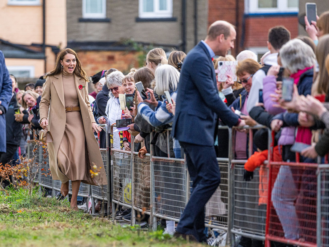 Kate Middleton, Princess of Wales, and Prince William, Prince of Wales greet the public as they arrive to visit "The Street."
